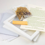 Herbal product with packaging and instructions on a white surface