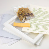 Herbal product with packaging and instructions on a white surface